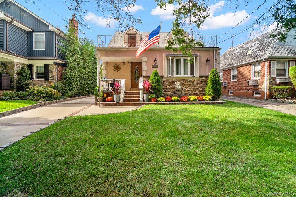 21 Jasper Street Valley Stream, NY 11580 - Photo 1 of 27 a view of a house with a yard and sitting area