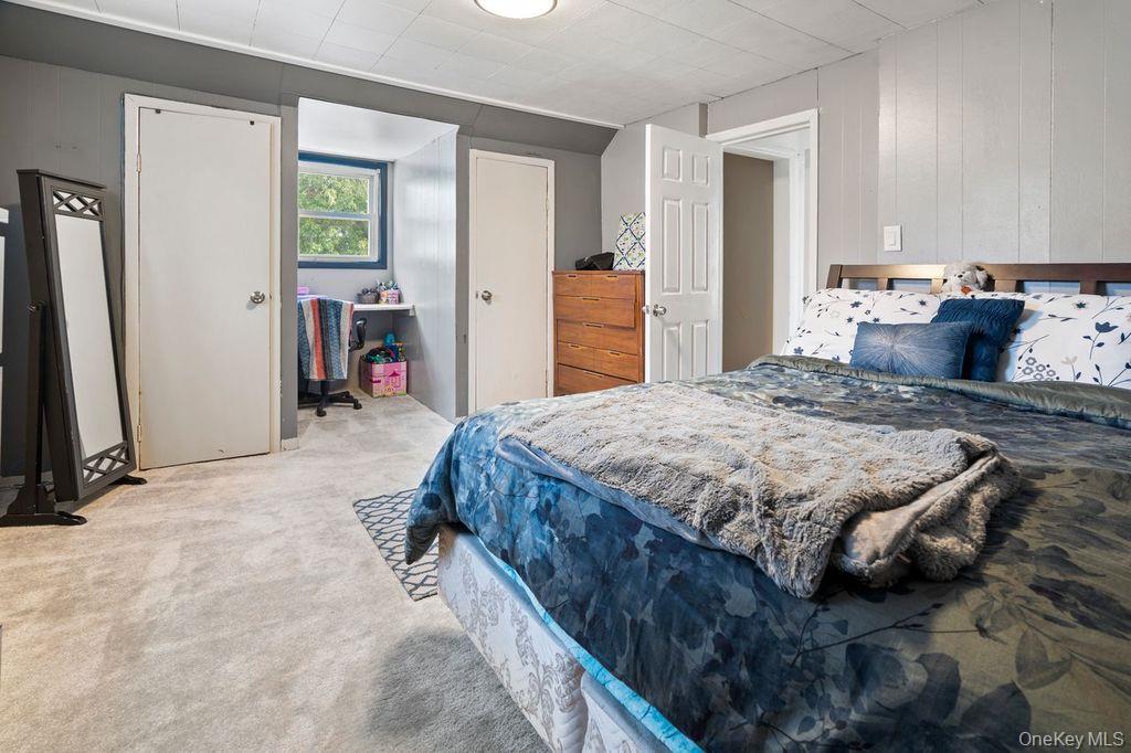 21 Jasper Street Valley Stream, NY 11580 - Photo 13 of 27 a bedroom with a bed and a window