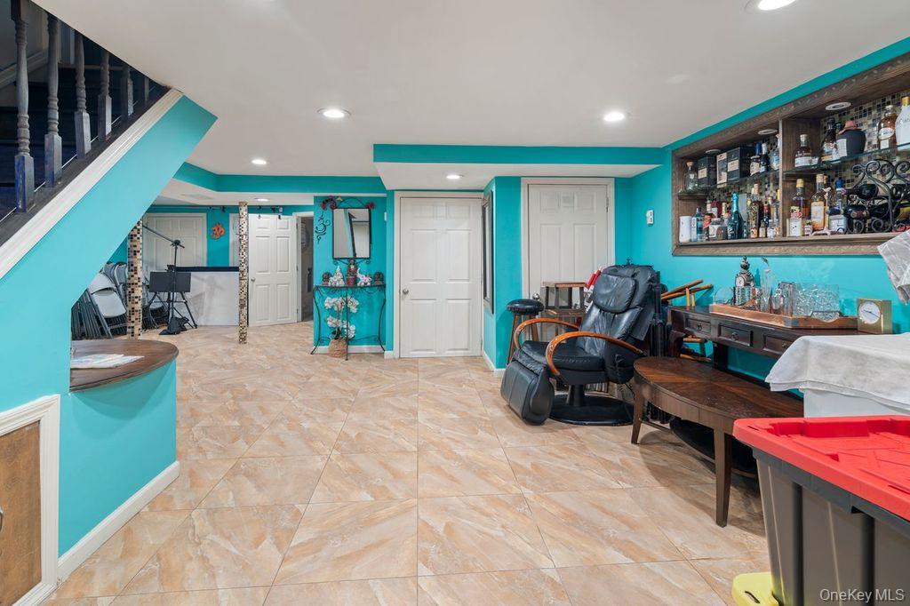 21 Jasper Street Valley Stream, NY 11580 - Photo 17 of 27 a living room with furniture and a flat screen tv