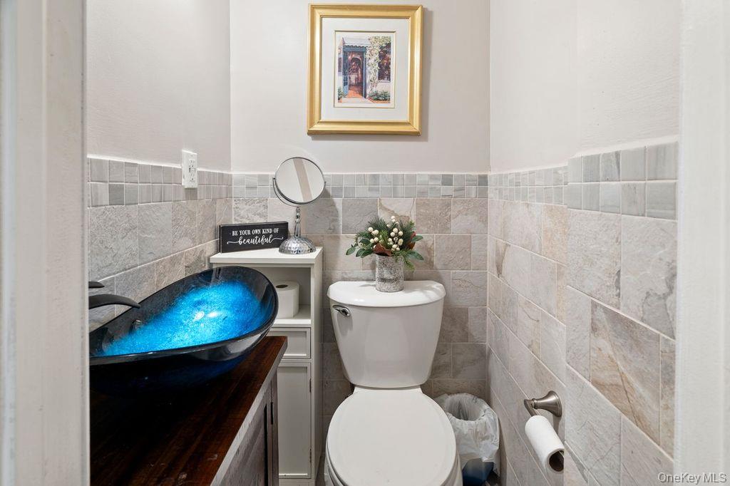 21 Jasper Street Valley Stream, NY 11580 - Photo 19 of 27 a bathroom with a toilet and a sink