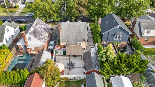 a aerial view of a house with a yard and sitting area
