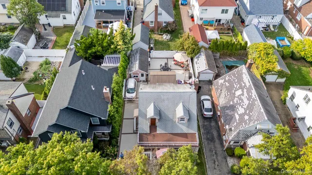 an aerial view of multiple houses with yard