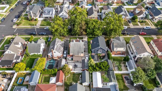 a view of multiple houses with yard