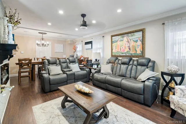 a living room with furniture wooden floor and window