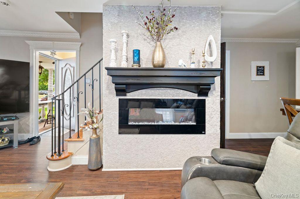 21 Jasper Street Valley Stream, NY 11580 - Photo 6 of 27 a living room with furniture and a fireplace
