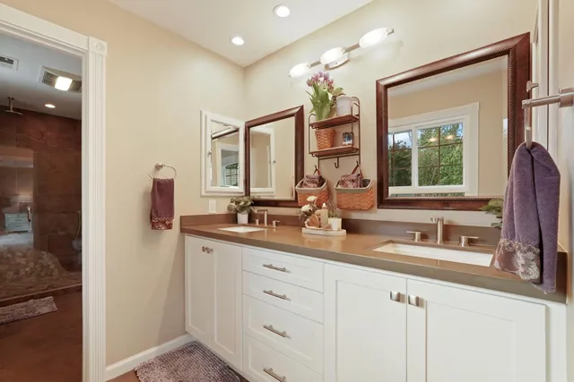 a kitchen with stainless steel appliances granite countertop a sink and a white cabinets