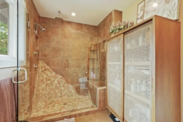 a view of a patio with a table and chairs under an umbrella