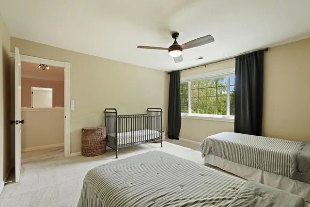 a view of a patio with table and chairs under an umbrella