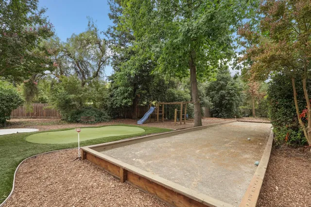 a bathroom with a double vanity sink mirror and shower