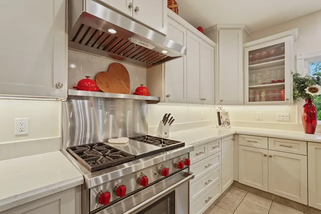 a view of a dining room with furniture wooden floor and chandelier