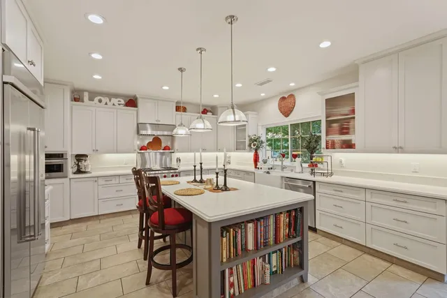 a living room with furniture a rug and a fireplace