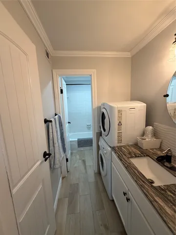 a view of bathroom with a washer and dryer
