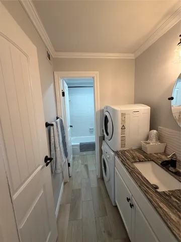 a view of bathroom with a washer and dryer