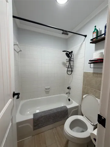 a bathroom with a sink a toilet and a bathtub