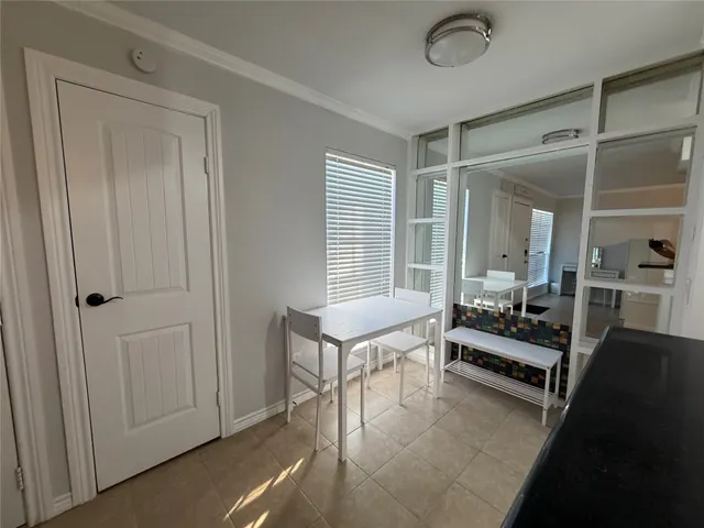 a bathroom with a shower a sink and a toilet