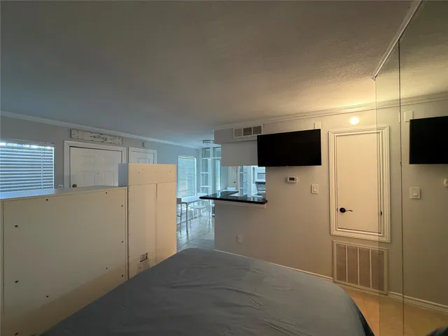 a kitchen with a refrigerator and a stove