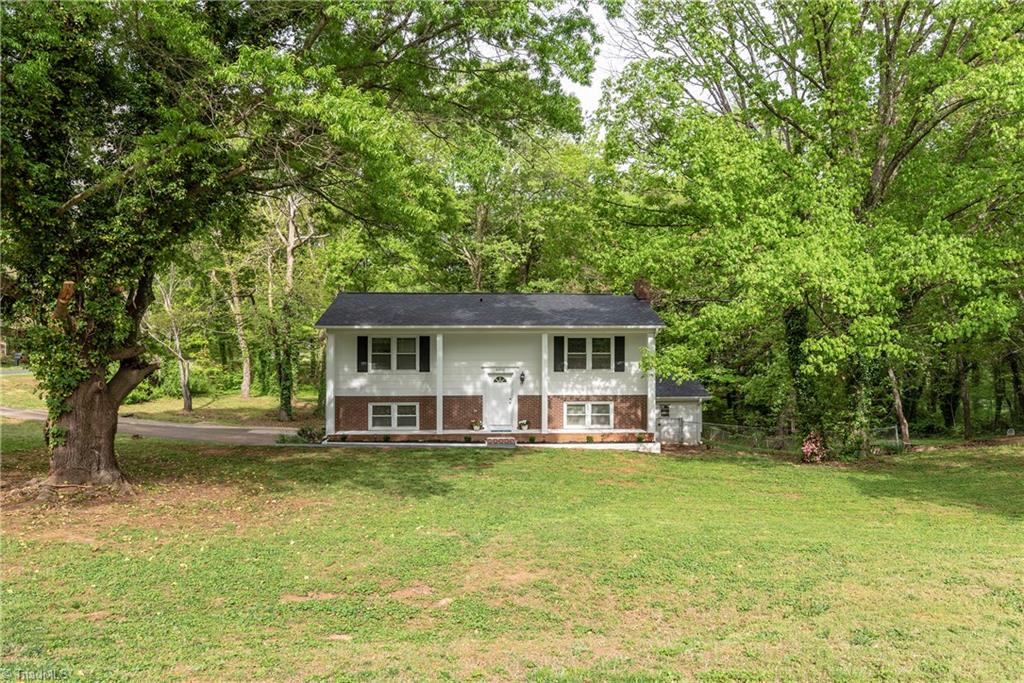 6300 Wynyard Avenue Rural Hall, NC 27045 - Photo 1 of 23 Exterior view - large lot, plenty of shade, house is located near shopping centers and highway, and on the border line of Winston-Salem.