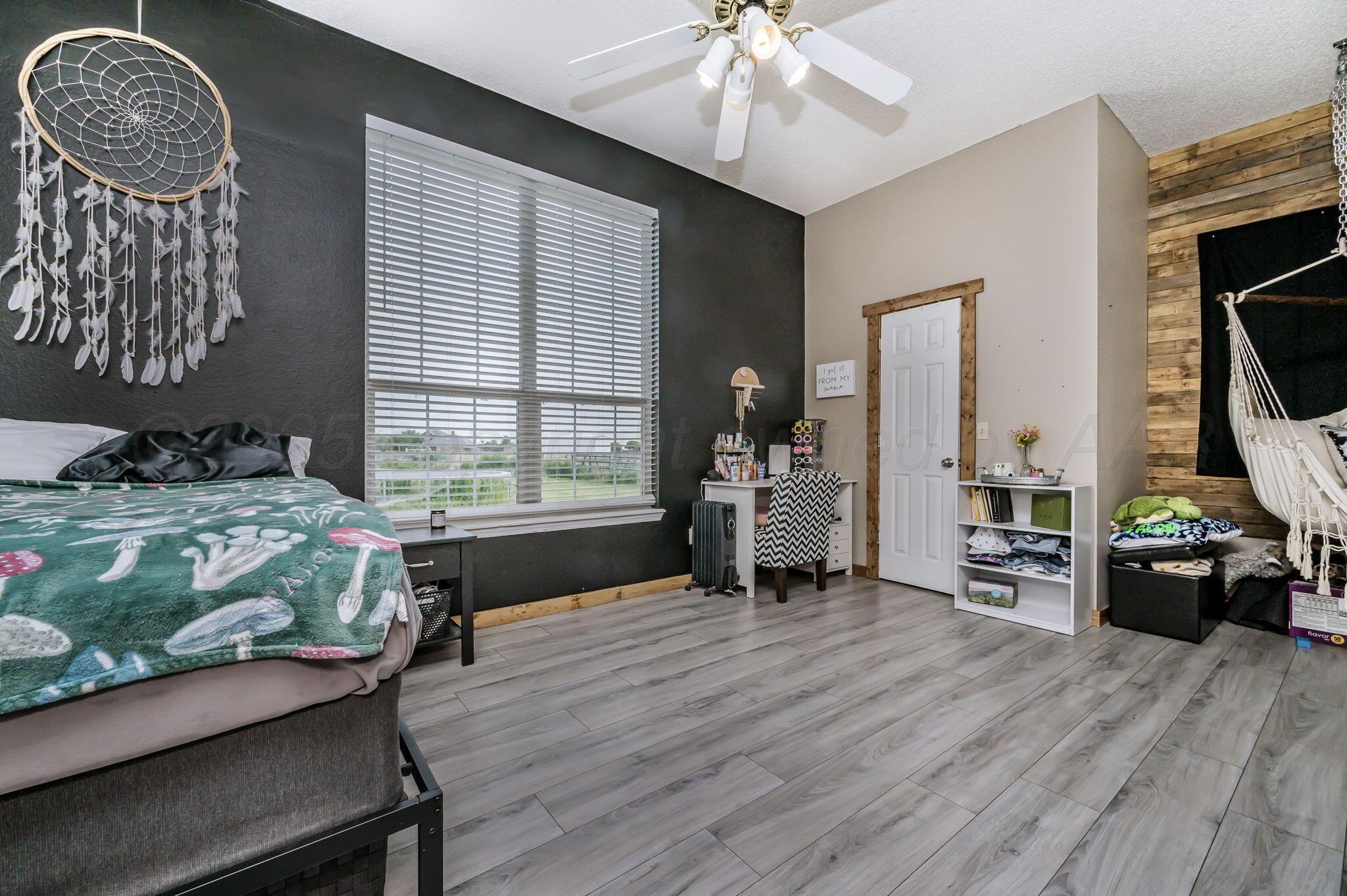 620 Lantana Road Bushland, TX 79124 - Photo 14 of 34 a living room with furniture and a window