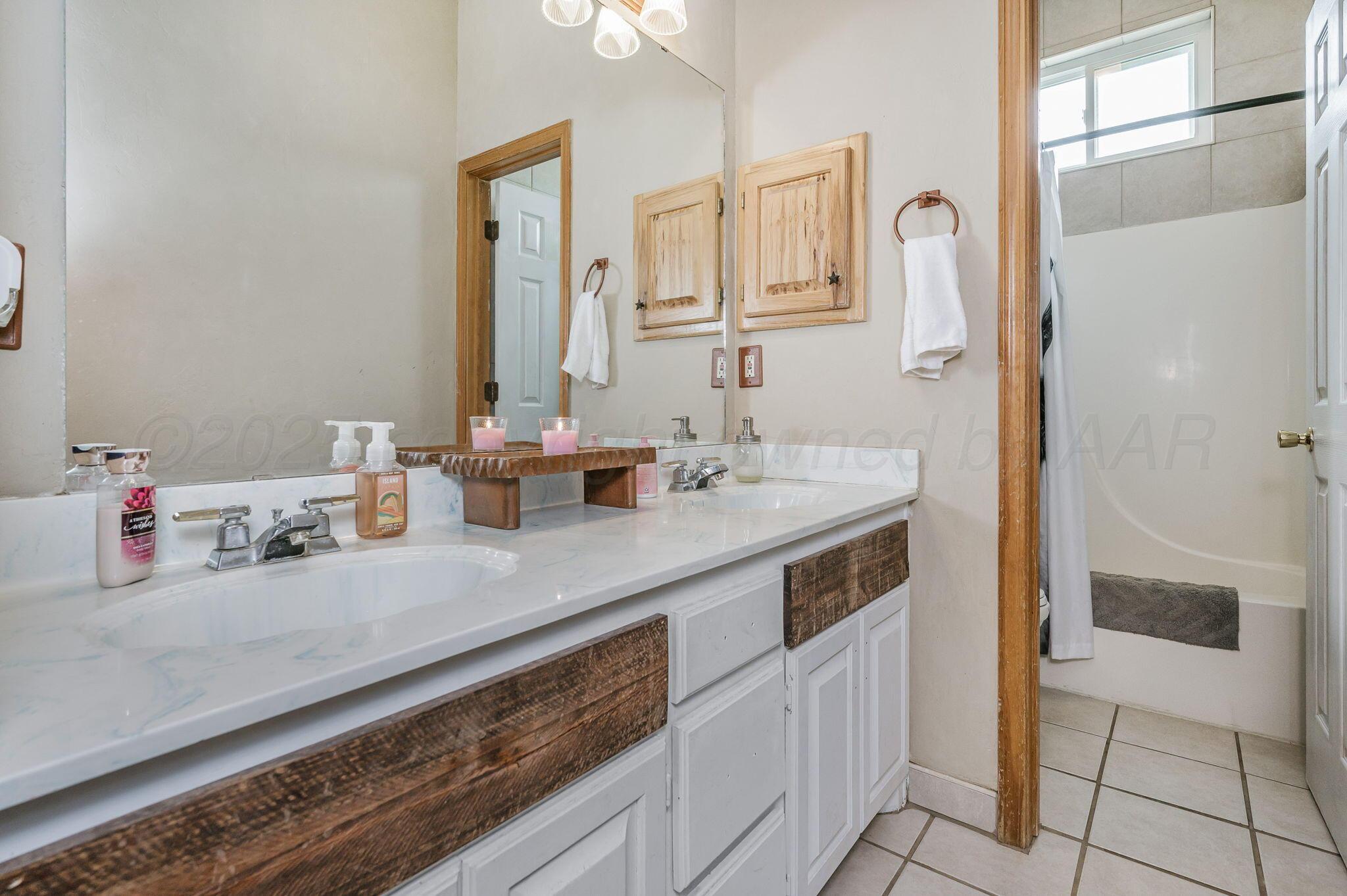 620 Lantana Road Bushland, TX 79124 - Photo 18 of 34 a bathroom with a sink and a mirror