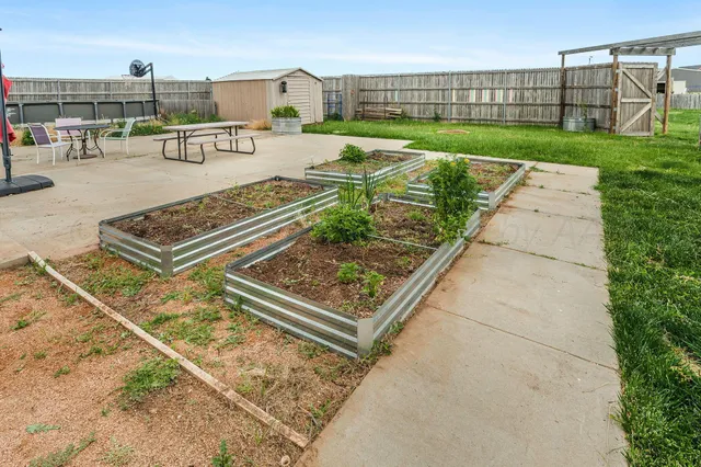 a view of a house with swimming pool and a yard