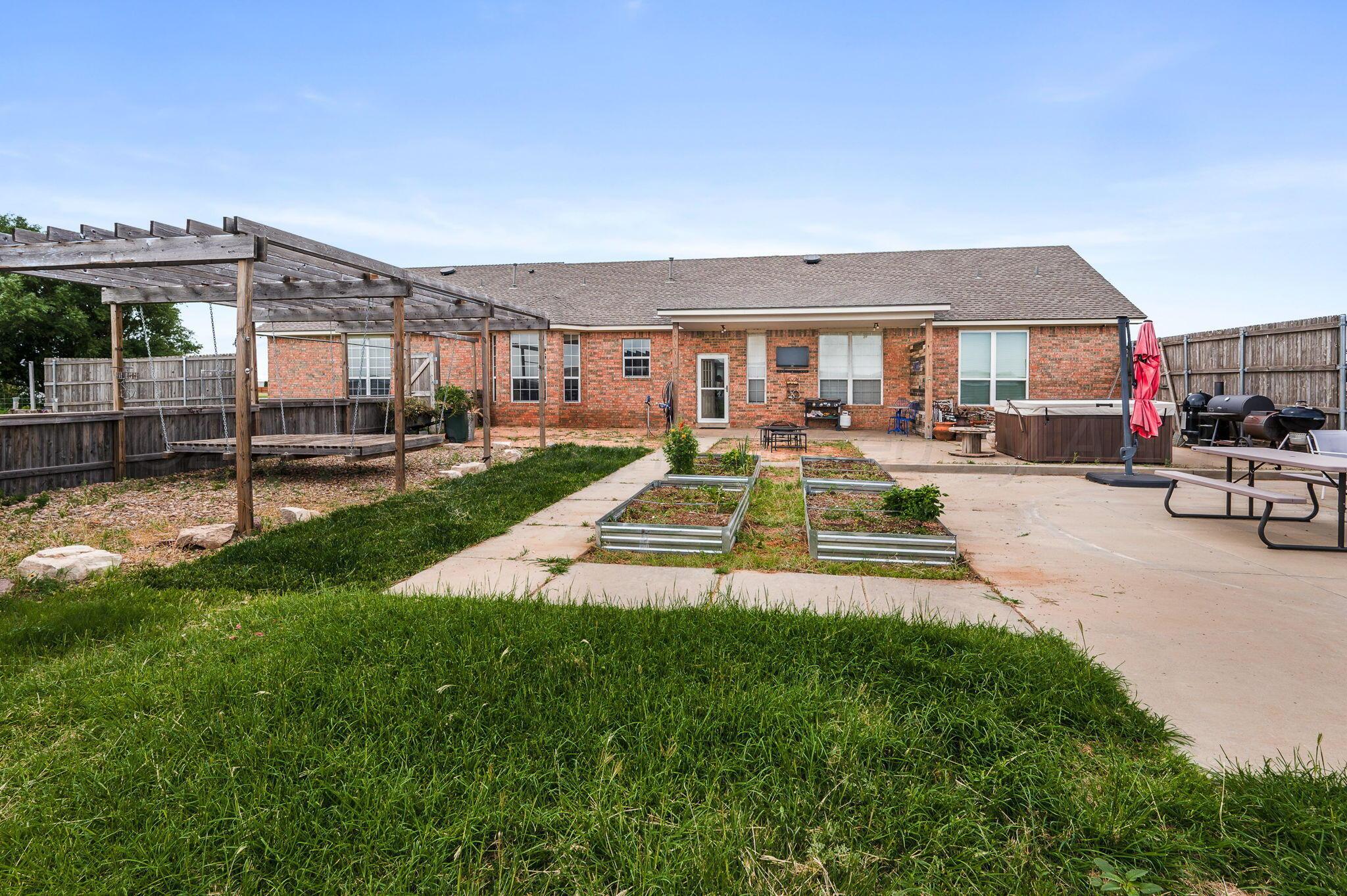 620 Lantana Road Bushland, TX 79124 - Photo 25 of 34 a view of a house with swimming pool and a yard
