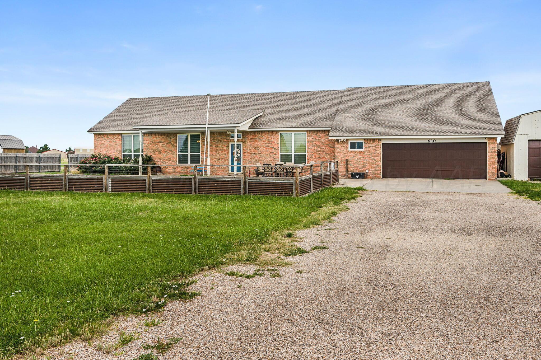 620 Lantana Road Bushland, TX 79124 - Photo 29 of 34 a front view of a house with a yard and garage