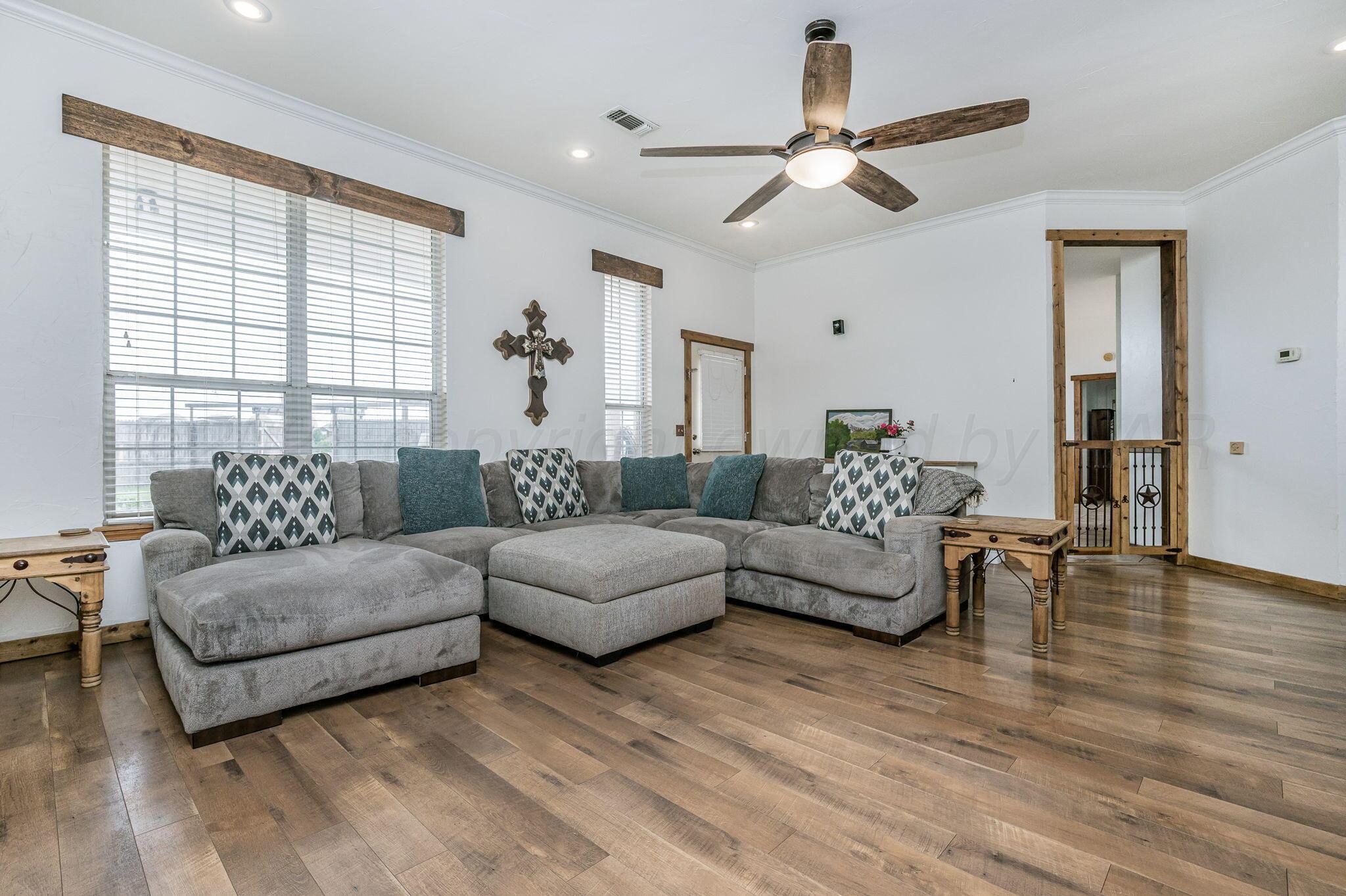 620 Lantana Road Bushland, TX 79124 - Photo 3 of 34 a living room with furniture and a large window