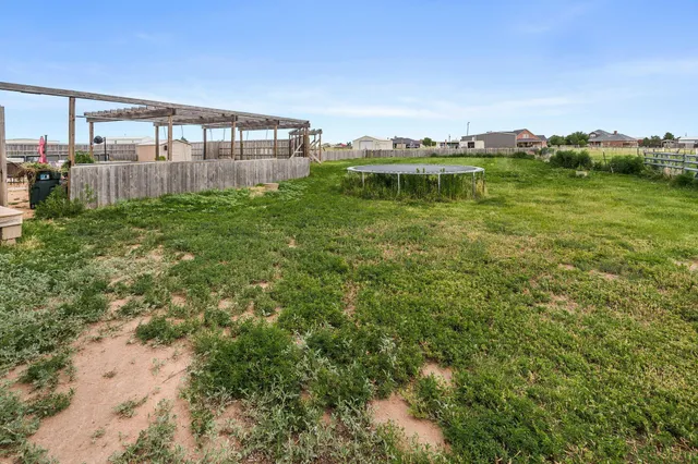 a view of a backyard with sitting area