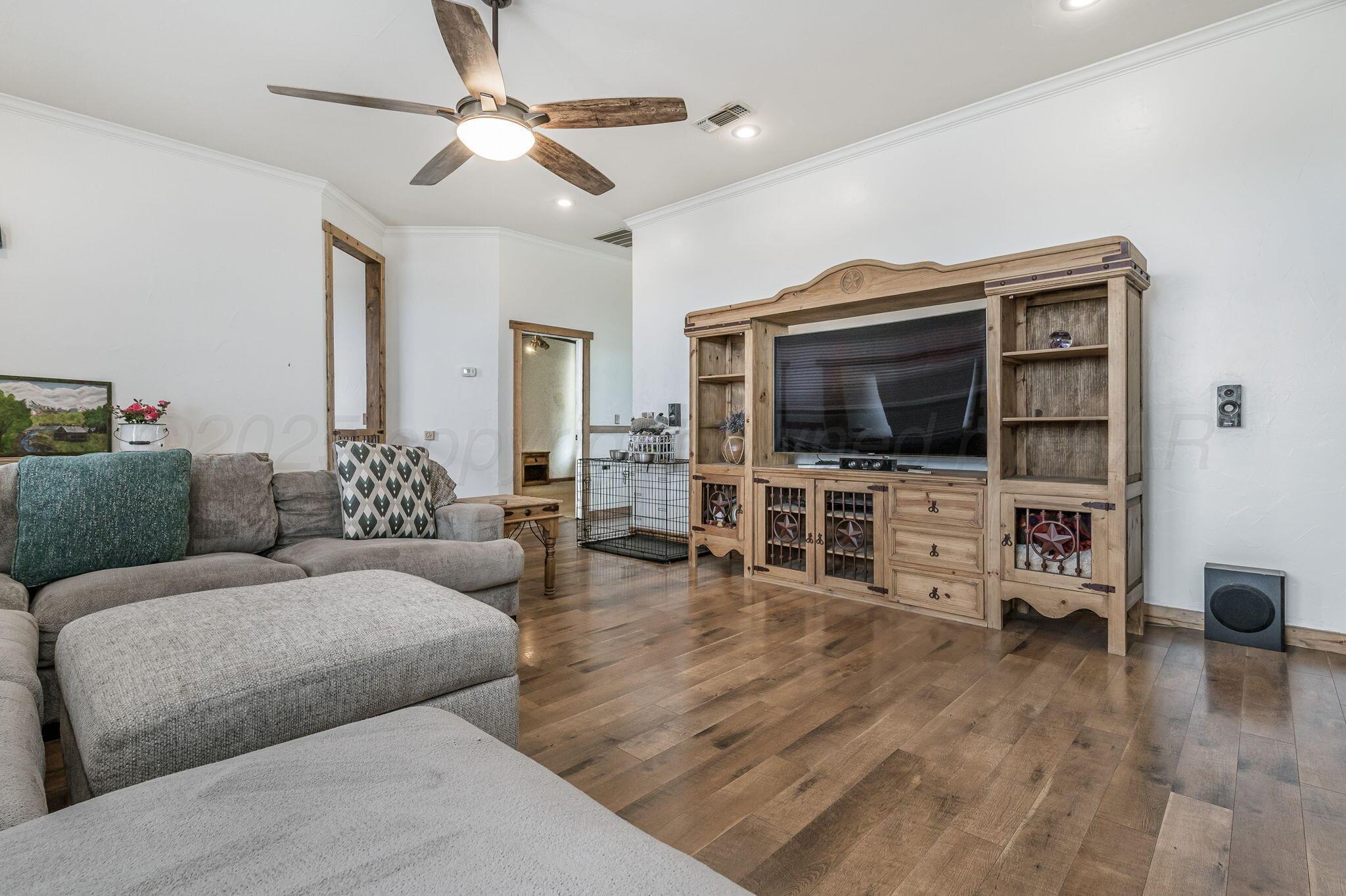 620 Lantana Road Bushland, TX 79124 - Photo 5 of 34 a living room with furniture and a flat screen tv