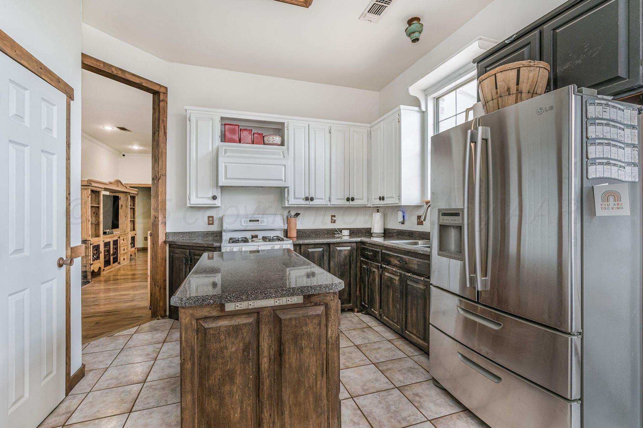 620 Lantana Road Bushland, TX 79124 - Photo 7 of 34 a kitchen with stainless steel appliances granite countertop a refrigerator sink and stove