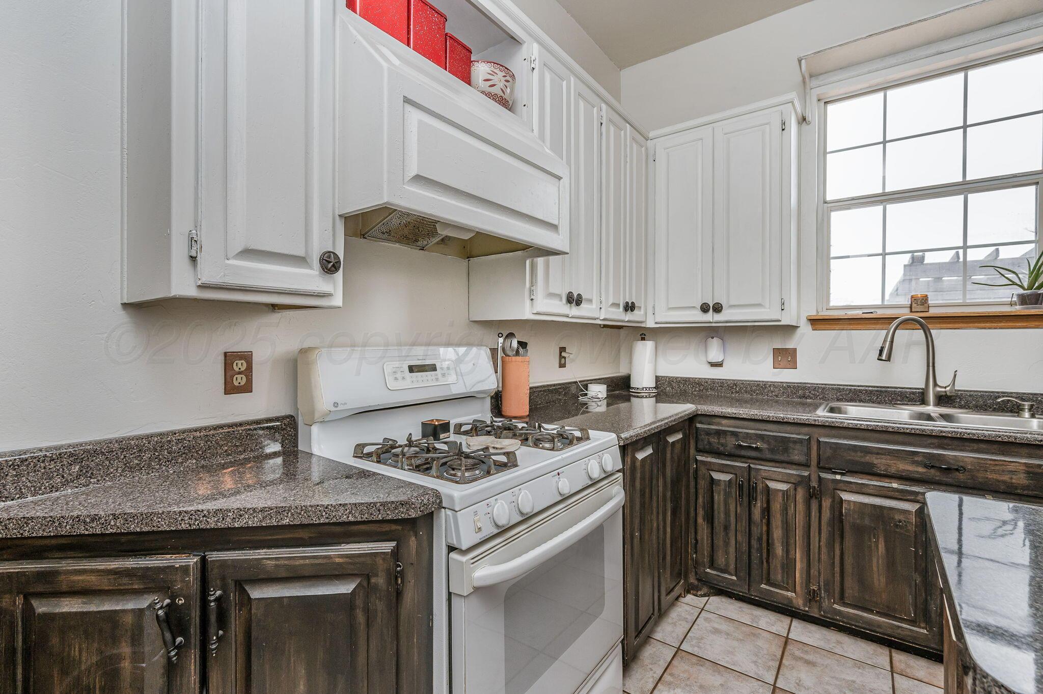 620 Lantana Road Bushland, TX 79124 - Photo 8 of 34 a kitchen with stainless steel appliances granite countertop a sink stove and cabinets