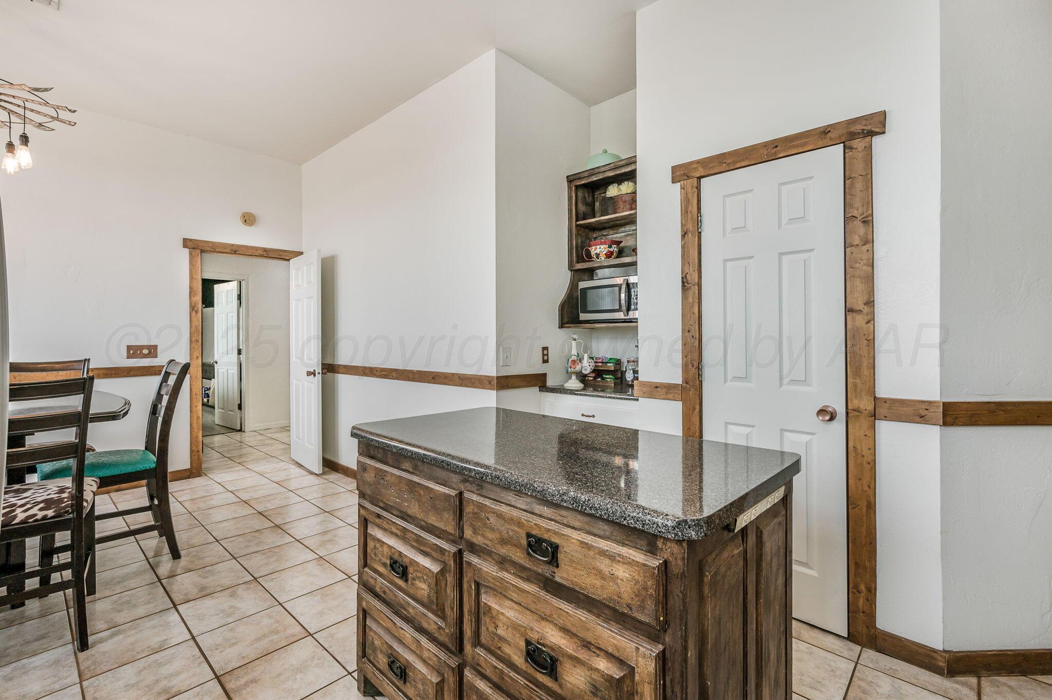 620 Lantana Road Bushland, TX 79124 - Photo 9 of 34 a kitchen with stainless steel appliances granite countertop a sink and a refrigerator