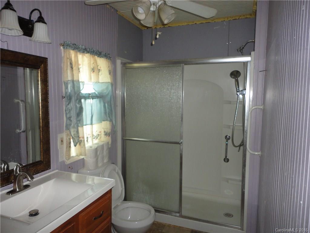 103 Williamson Street Fort Mill, SC 29715 - Photo 11 of 13 a bathroom with a shower a sink a toilet and mirror