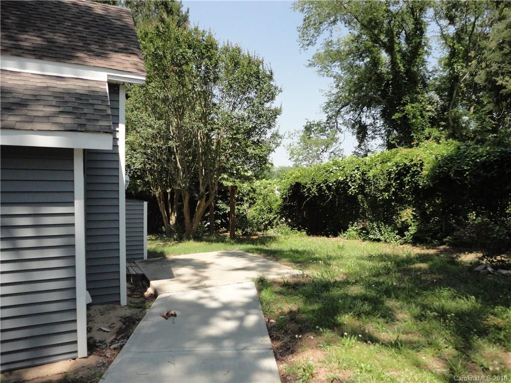 103 Williamson Street Fort Mill, SC 29715 - Photo 4 of 13 a backyard of a house with a yard and outdoor seating