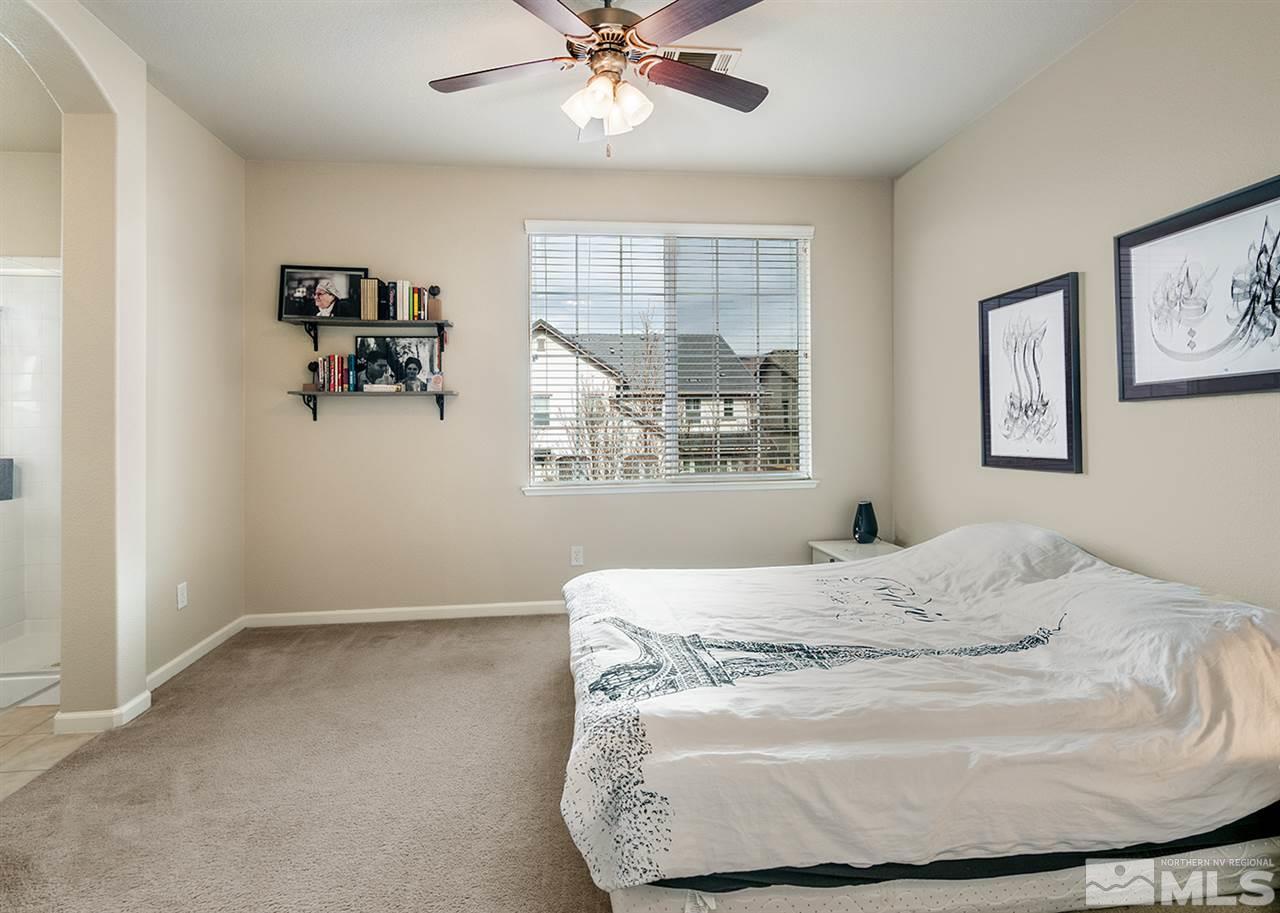 1955 Wind Ranch Road Reno, NV 89521 - Photo 15 of 18 a bedroom with a bed and window