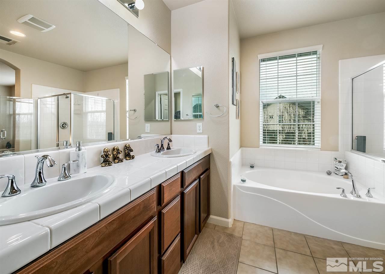 1955 Wind Ranch Road Reno, NV 89521 - Photo 16 of 18 a spacious bathroom with sink shower double vanity