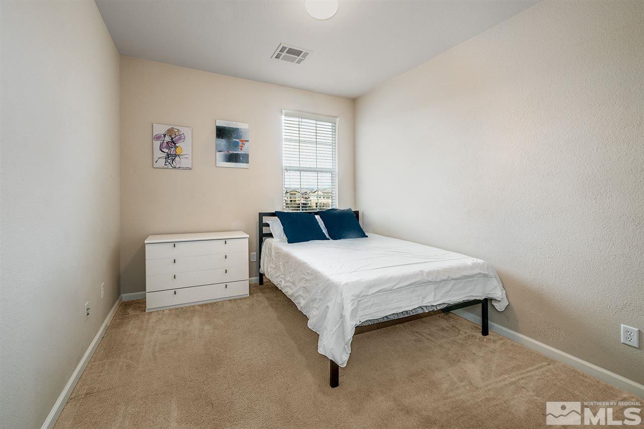 1955 Wind Ranch Road Reno, NV 89521 - Photo 17 of 18 a bedroom with a bed and window