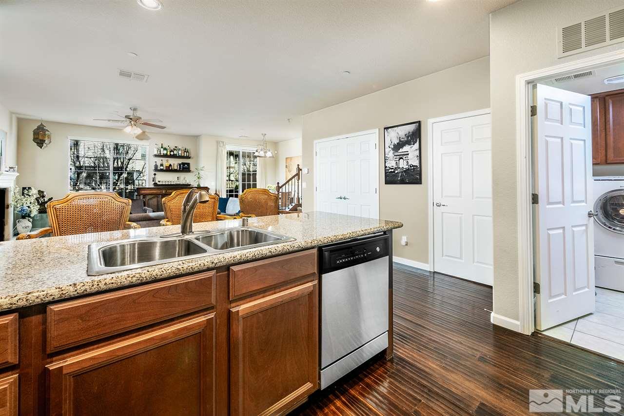 1955 Wind Ranch Road Reno, NV 89521 - Photo 9 of 18 a view of a kitchen with stainless steel appliances granite countertop a stove and a sink