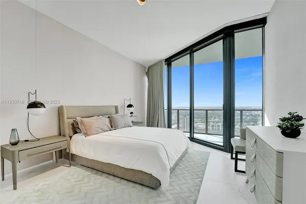 a bathroom with a granite countertop sink toilet a mirror and shower