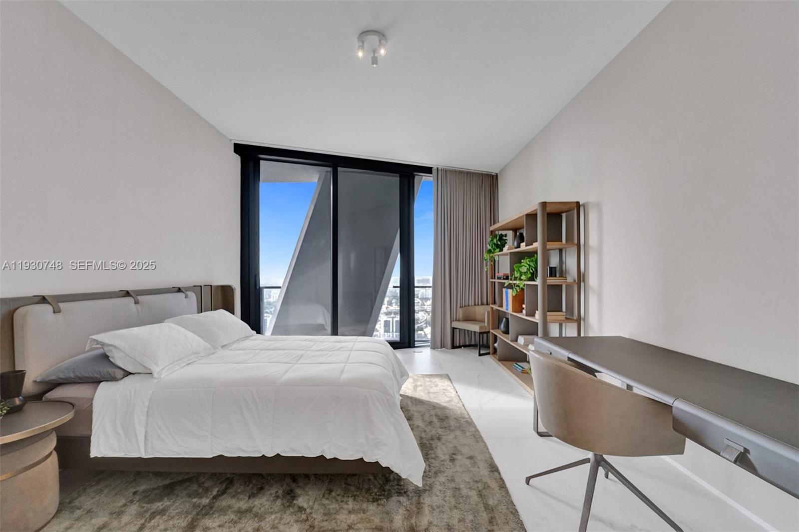 1000 Biscayne Boulevard, Unit 3902 Miami, FL 33132 - Photo 17 of 51 a bedroom with a bed and large windows