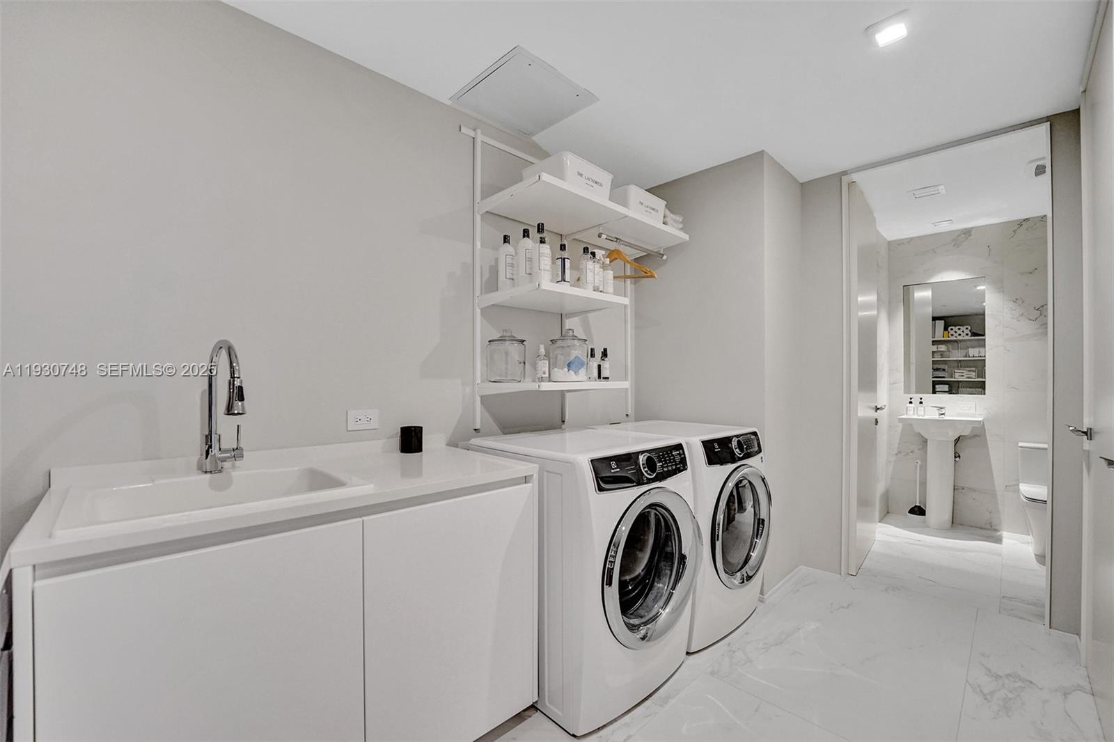 1000 Biscayne Boulevard, Unit 3902 Miami, FL 33132 - Photo 22 of 51 a utility room with dryer and washer