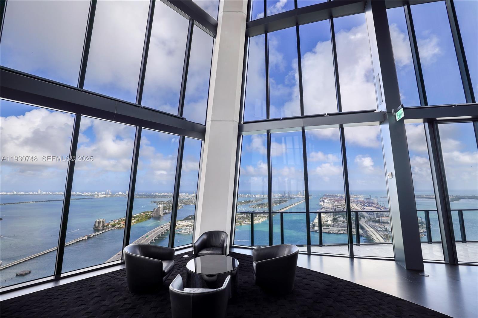 1000 Biscayne Boulevard, Unit 3902 Miami, FL 33132 - Photo 23 of 51 a living room with large windows