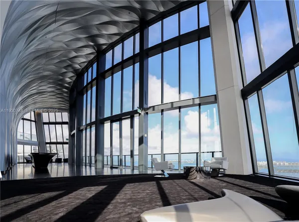 a living room with large windows