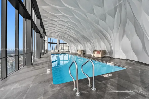 a view of staircase with a rug