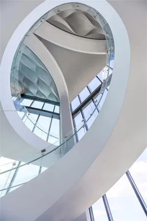 a view of a house with backyard porch and sitting area