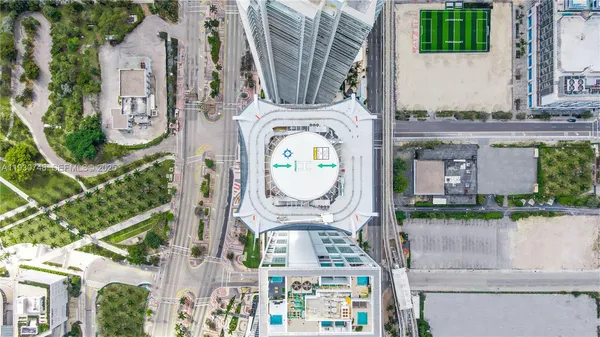 a view of a roof deck with furniture