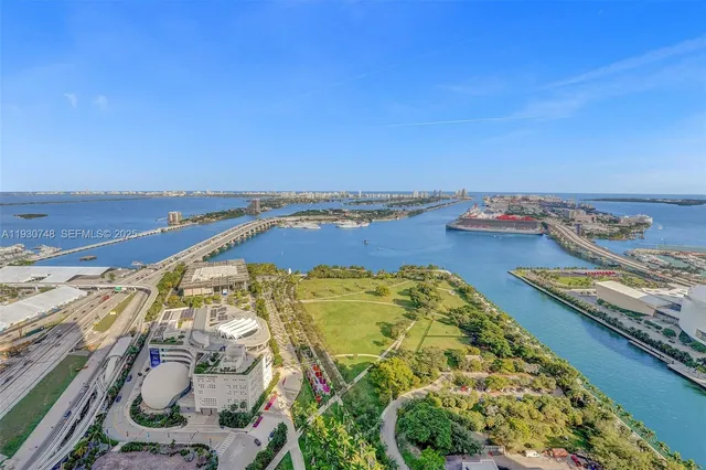 an aerial view of a residential apartment building with swimming pool
