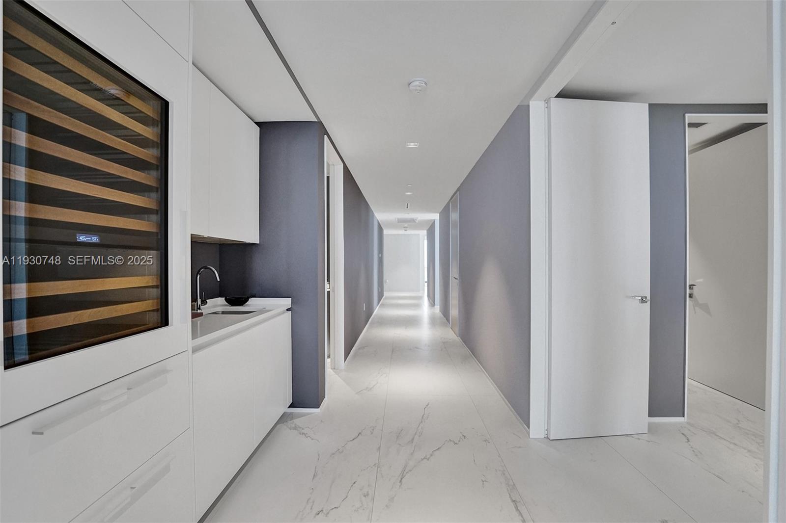 1000 Biscayne Boulevard, Unit 3902 Miami, FL 33132 - Photo 6 of 51 a view of a kitchen with refrigerator and white walls