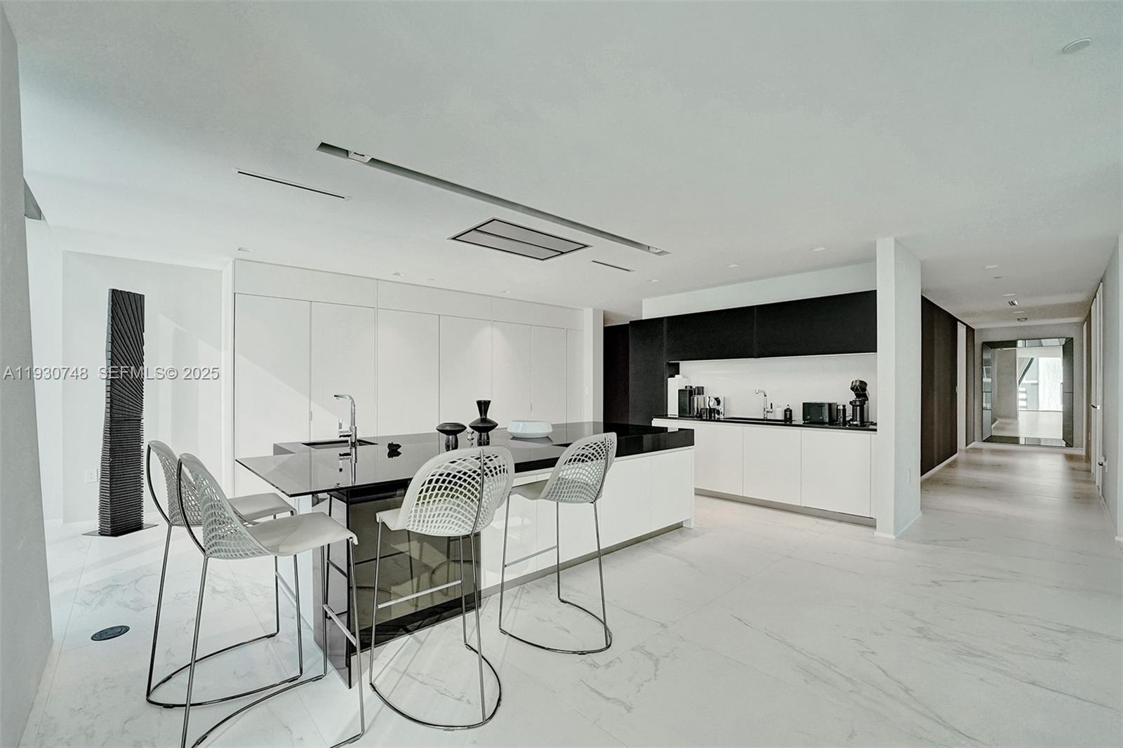 1000 Biscayne Boulevard, Unit 3902 Miami, FL 33132 - Photo 7 of 51 a living room with furniture and kitchen view