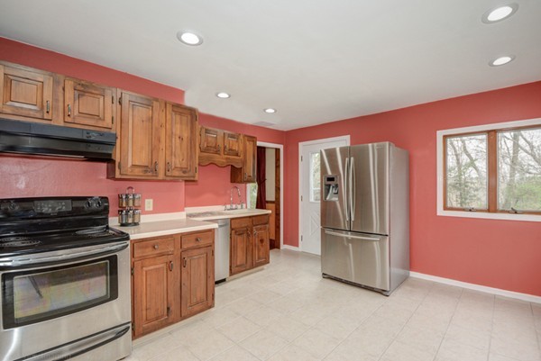188 Shirley Road Lancaster, MA 01523 - Photo 15 of 27 a kitchen with stainless steel appliances granite countertop a refrigerator stove and sink